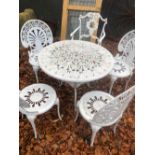 CAST METAL TABLE AND FIVE CHAIRS