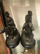 TWO SPELTER ANTHROPOMORPHIC FIGURES OF RIDERS ON HORSEBACK