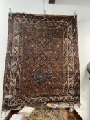 AN ANTIQUE PERSIAN SHIRAZ RUG