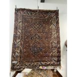 AN ANTIQUE PERSIAN SHIRAZ RUG