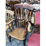 A 19th C. SADDLE SEATED ELBOW CHAIR WITH A CURVED TOP RAIL OVER THE FIVE BAR BACK