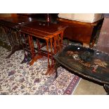 TWO NESTS OF MAHOGANY TABLES AND A LACQUER COFFEE TABLE.