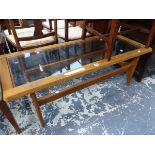 A 20th C. GLASS TOPPED TEAK COFFEE TABLE. W 120 x D 50 x H 42cms.