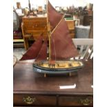 A VINTAGE MODEL SAILING BOAT.