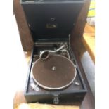 A VINTAGE HMV PORTABLE GRAMOPHONE AND VARIOUS RECORDS.