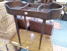 A MAHOGANY NEEDLE WORK TABLE, THE GALLERIED TOP DIVIDED INTO THREE COMPARTMENTS, THE FOUR SQUARE