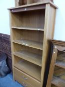 A 20th C. OAK OPEN BOOK CASE WITH FOUR SHELVES OVER TWO DRAWERS. W 86 x D 40 x H 181cms.