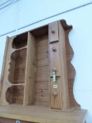 A PINE ENCLOSED DRESSER BACK, THE ARCADED TOP SHELF ABOVE ANOTHER SHELF AND THREE DRAWERS