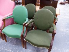 A SET OF FOUR MAHOGANY ELBOW CHAIRS WITH GREEN UPHOLSTERED OVAL BACKS AND SERPENTINE FRONTED SEATS