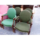 A SET OF FOUR MAHOGANY ELBOW CHAIRS WITH GREEN UPHOLSTERED OVAL BACKS AND SERPENTINE FRONTED SEATS