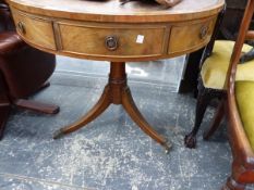 A MAHOGANY DRUM TABLE, THE LEATHER INSET TOP ABOVE REAL AND CONCEIT DRAWERS ROTATING ON A GUN BARREL