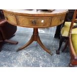 A MAHOGANY DRUM TABLE, THE LEATHER INSET TOP ABOVE REAL AND CONCEIT DRAWERS ROTATING ON A GUN BARREL