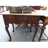 A GEORGE III OAK LOWBOY WITH THREE DRAWERS, A WAVY APRON, CABRIOLE LEGS AND POINTED PAD FEET. W 72.5