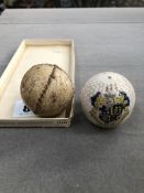 A FEATHERY TYPE SEWN SMALL BALL, AND A CRESTED BOURNMOUTH GOLF BALL ORNAMENT.