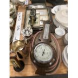 AN ENGLISH MADE EDWARDIAN PERIOD DESK THERMOMETER, A WALL BAROMETER, VARIOUS MILITARY PRINTS, AND