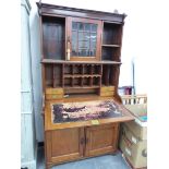 A VICTORIAN MAHOGANY WRITING CABINET WITH SHELVES FLANKING THE GLAZED DOOR ABOVE THE FALL FRONT, THE