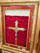 A GILT AND SILVERED METAL FRAMED CRUCIFIX