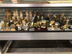 AN EXTENSIVE MENAGERIE OF FIGURINES TO INCLUDE BIRDS, MEERCATS, PANDAS AND POLAR BEARS, INCLUDING