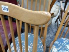 A SET OF FOUR ERCOL STICK BACK DINING CHAIRS