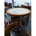 A VICTORIAN MAHOGANY TRIPOD TABLE, THE CIRCULAR TOP GLAZED OVER FLORAL SILK WORK, THE BARLEY TWIST