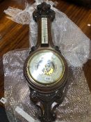 A LARGE VICTORIAN ANEROID BAROMETER.