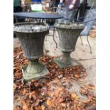 A PAIR OF CAST STONE PLANTERS. H. 67cms