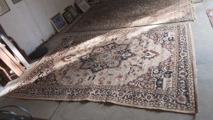 A BROWN AND CREAM LARGE CARPET