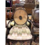 A PAIR OF MAHOGANY ELBOW CHAIRS WITH CANED OVAL BACKS AND ON SQUARE SECTIONED FRONT LEGS TAPERING TO