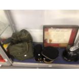 TWO VINTAGE GAS MASKS, TWO ROYAL COR OF TRANSVAAL CAPS, A GERMAN 1939 HELMET, AND A DUNKIRK FRAMED