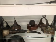 TWO PAIRS OF EASTERN STIRRUPS, A CANNON BALL, A WHITE METAL MOUNTED HORN, ETC.