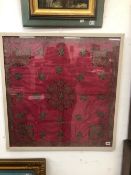 AN ANTIQUE EASTERN METAL THREAD AND RED SILK NEEDLEWORK PANEL 74 x 72cms
