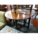 A 19th C. OAK OVAL DROP FLAP TABLE ON TURNED LEGS WITH SQUARE FEET. W 127 x D 89 x H 73cms.
