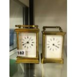 A TAYLOR AND BLIGH BRASS CASED CARRIAGE CLOCK, TOGETHER WITH AN UNSIGNED CARRIAGE CLOCK.