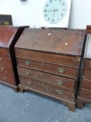 A GEORGE III MAHOGANY BUREAU, THE OAK BANDED FALL ENCLOSING A WELL ABOVE THREE GRADED LONG DRAWERS