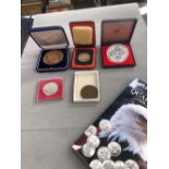 A QUANTITY OF VINTAGE COINS AND MEDALLIONS.
