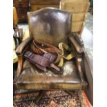 A CLOSE NAILED LEATHER DESK CHAIR ROTATING ON MAHOGANY CRUCIFORM LEGS