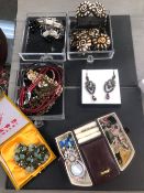 A EXTENSIVE COLLECTION OF MODERN COSTUME JEWELLERY CONTAINED IN VARIOUS JEWELLERY CASES.