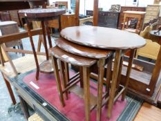 A 20th C. NEST OF THREE OAK OVAL TABLES, A FLORAL CARVED TWO TIER OCTAGONAL TABLE AND A TREFOIL