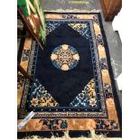 A GOOD QUALITY CHINESE RUG. 203 x 122cms