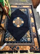 A GOOD QUALITY CHINESE RUG. 203 x 122cms