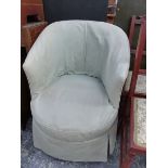 A VICTORIAN TUB ARMCHAIR, THE TURNED EBONISED LEGS ON BROWN CERAMIC CASTER FEET