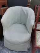 A VICTORIAN TUB ARMCHAIR, THE TURNED EBONISED LEGS ON BROWN CERAMIC CASTER FEET