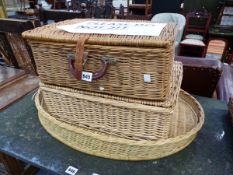 A CORACLE FITTED PICNIC BASKET, ANOTHER BASKET TOGETHER WITH A BASKET WORK OVAL TRAY