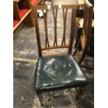 A SET OF FOUR MAHOGANY DINING CHAIRS EACH OF THE THREE BARS TO THE BACKS CLOVEN AT THE TOP AND BASE,