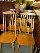 A SET OF ERCOL STYLE STICK CHAIRS.