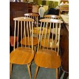 A SET OF ERCOL STYLE STICK CHAIRS.