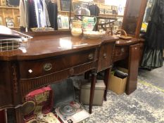 A BERESFORD HICKS MAHOGANY SIDEBOARD, THE BOWED CENTRAL DRAWER OVER A FLUTED BAND AND FLANKED BY