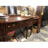 A BERESFORD HICKS MAHOGANY SIDEBOARD, THE BOWED CENTRAL DRAWER OVER A FLUTED BAND AND FLANKED BY