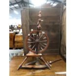 A 19th. C. FRUIT WOOD SPINNING WHEEL.
