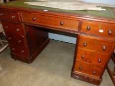 A VICTORIAN MAHOGANY TWIN PEDESTAL DESK.